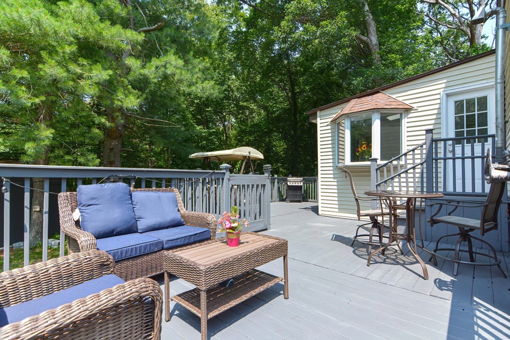 183 Brickel Road Stoughton, MA 02072 - Photo 35 of 38 a roof deck with a table and chairs
