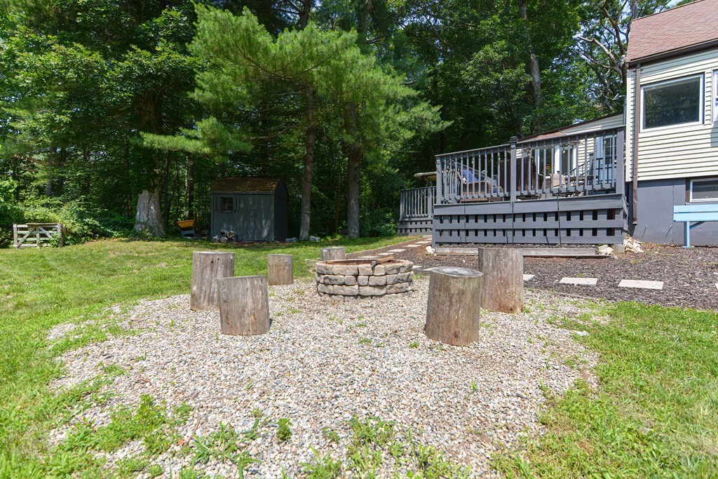 183 Brickel Road Stoughton, MA 02072 - Photo 38 of 38 a view of a deck with a wooden fence