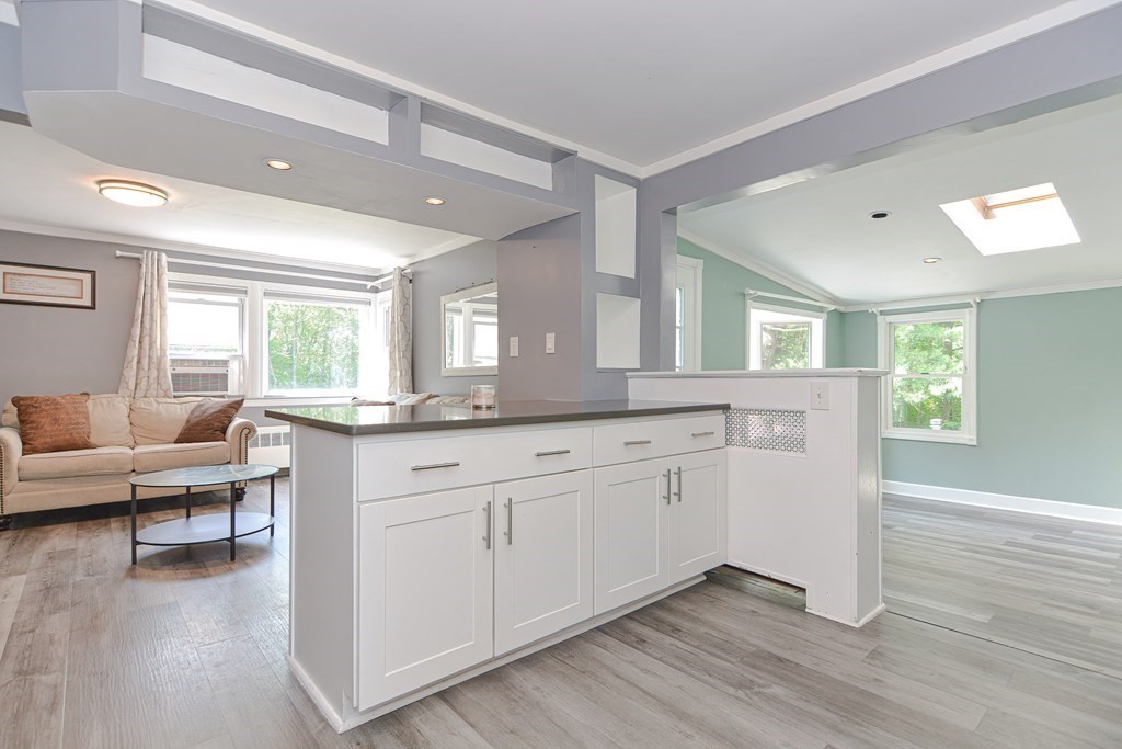 183 Brickel Road Stoughton, MA 02072 - Photo 6 of 38 a spacious bathroom with a granite countertop sink window and a mirror
