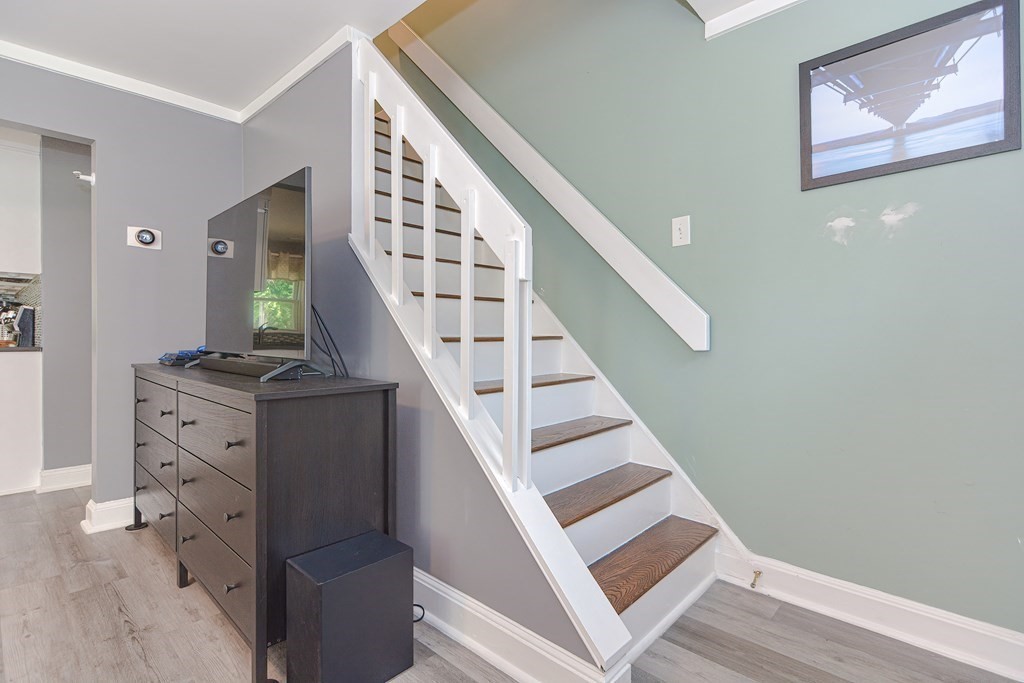 183 Brickel Road Stoughton, MA 02072 - Photo 10 of 38 a view of entryway and hall with wooden floor