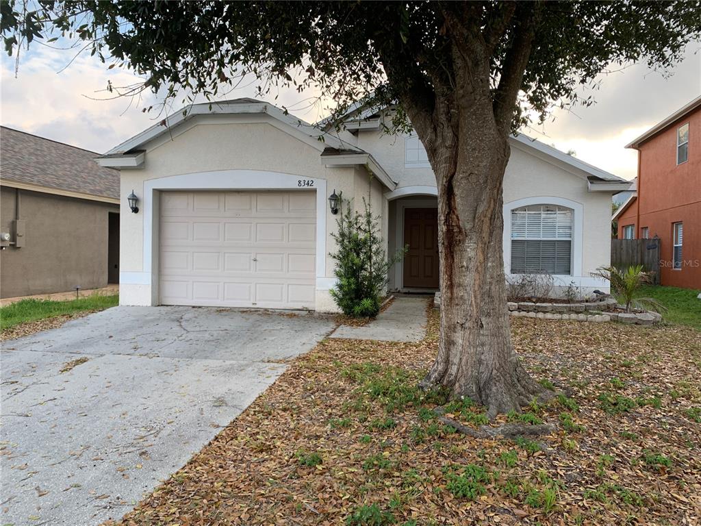 8342 Night Owl Court New Port Richey, FL 34655 - Photo 1 of 1 a front view of a house with a yard and garage