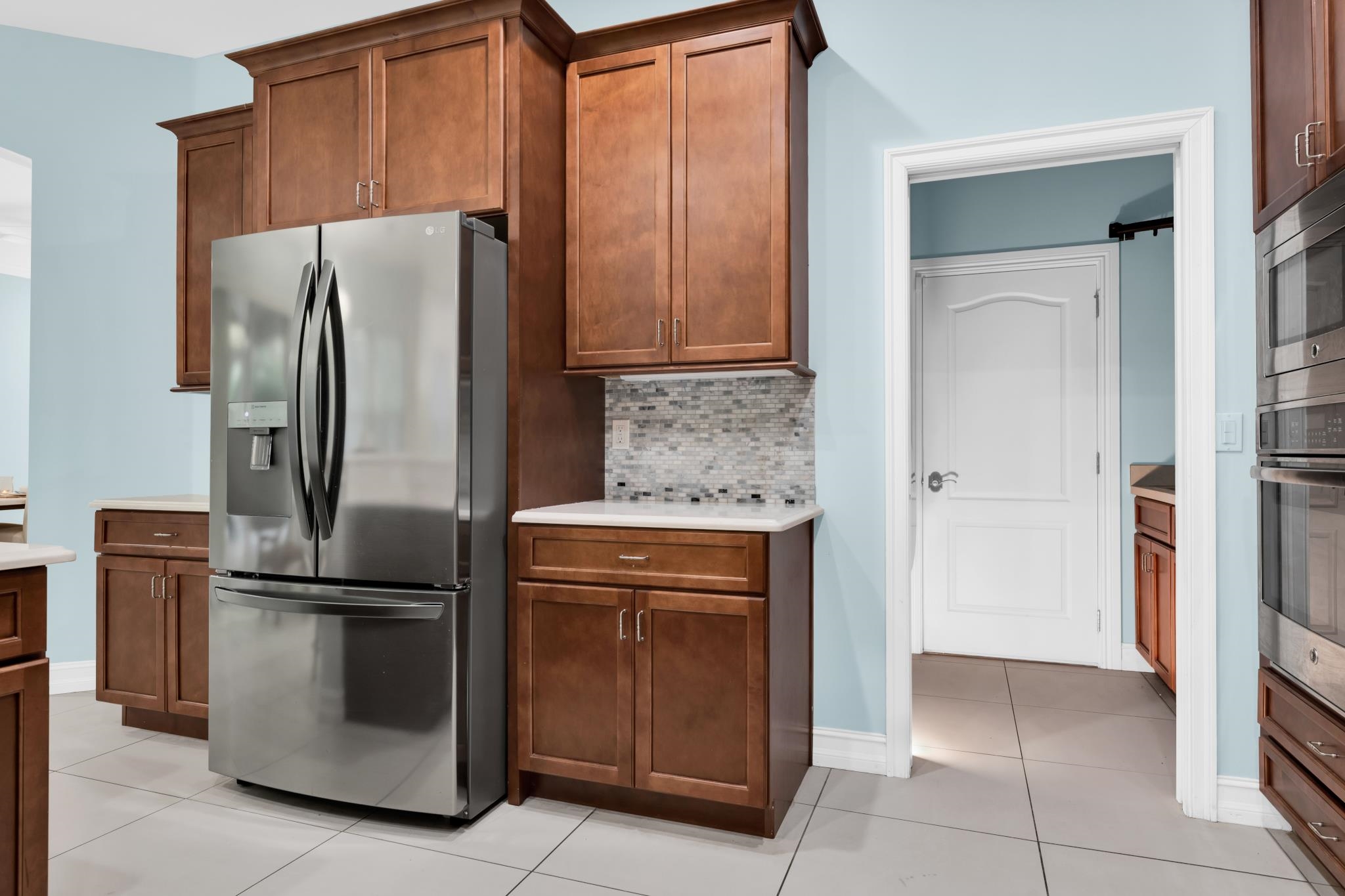 113 Needle Palm Drive St. Augustine, FL 32086 - Photo 16 of 46 a kitchen with granite countertop a refrigerator and a sink