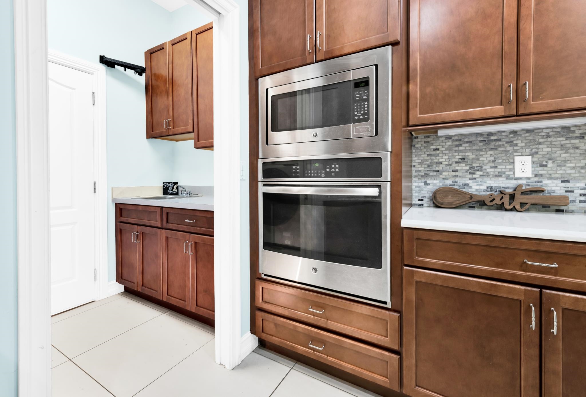 113 Needle Palm Drive St. Augustine, FL 32086 - Photo 17 of 46 a kitchen with appliances and cabinets