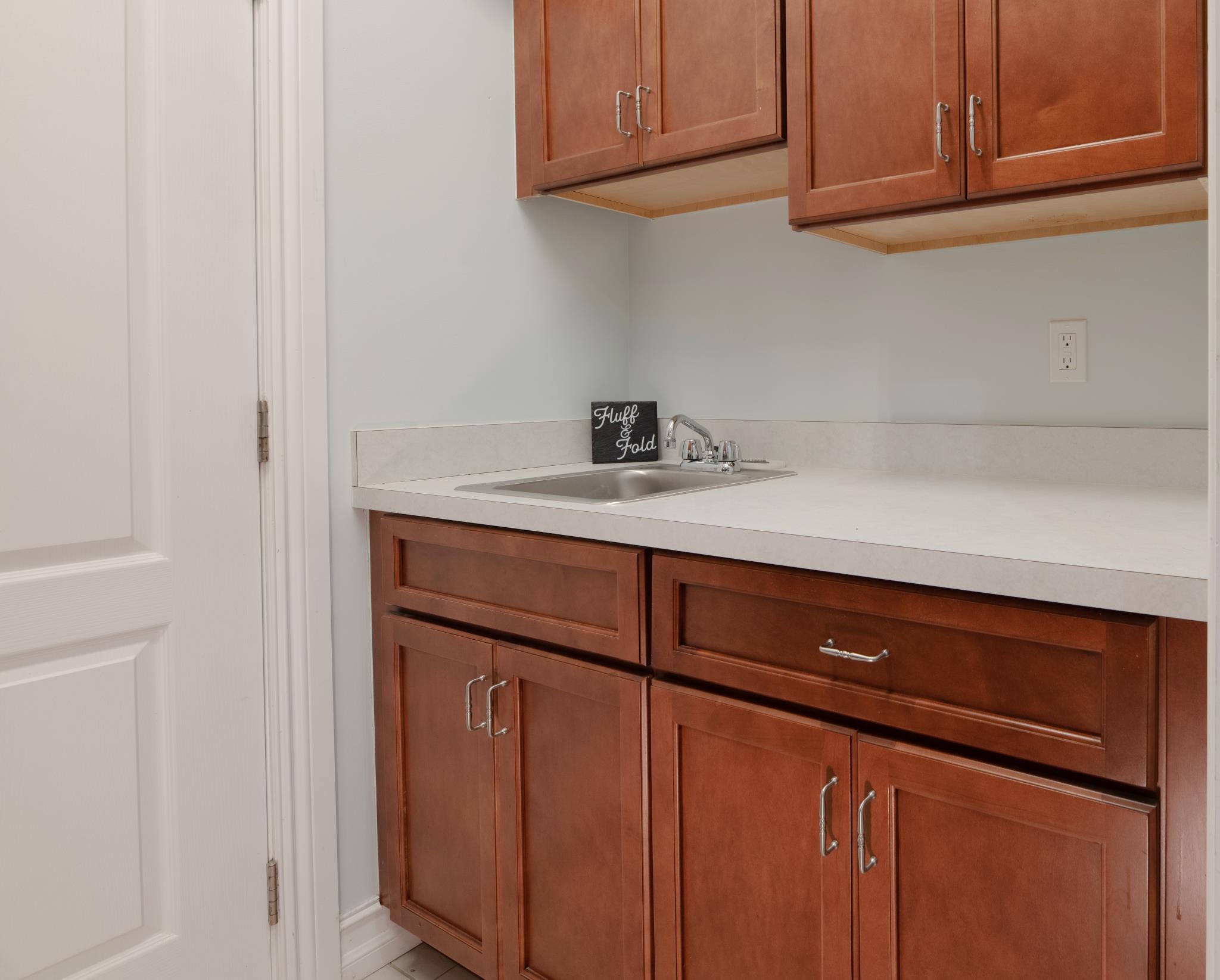 113 Needle Palm Drive St. Augustine, FL 32086 - Photo 18 of 46 a kitchen with a sink and cabinets
