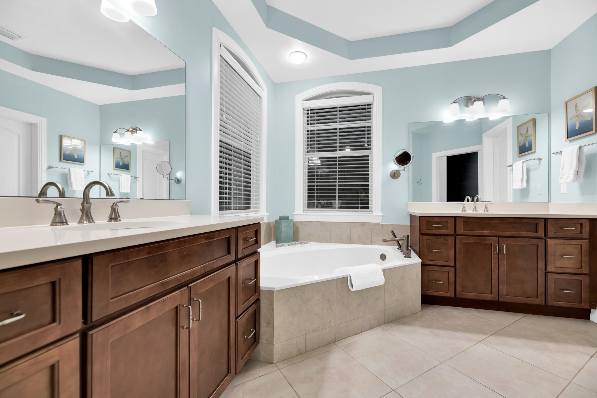 113 Needle Palm Drive St. Augustine, FL 32086 - Photo 30 of 46 a spacious bathroom with a tub sink and mirror