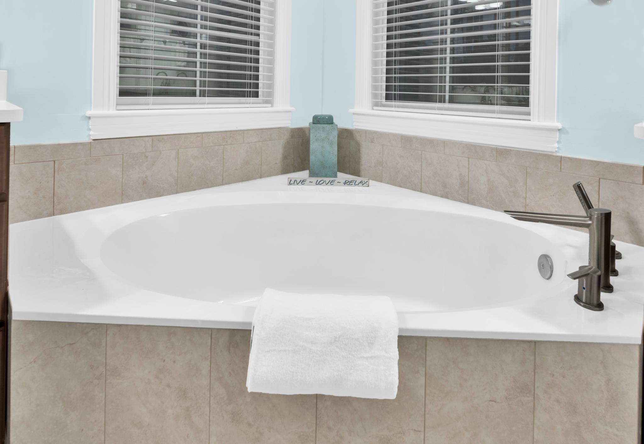 113 Needle Palm Drive St. Augustine, FL 32086 - Photo 31 of 46 a white bath tub sitting in a bathroom