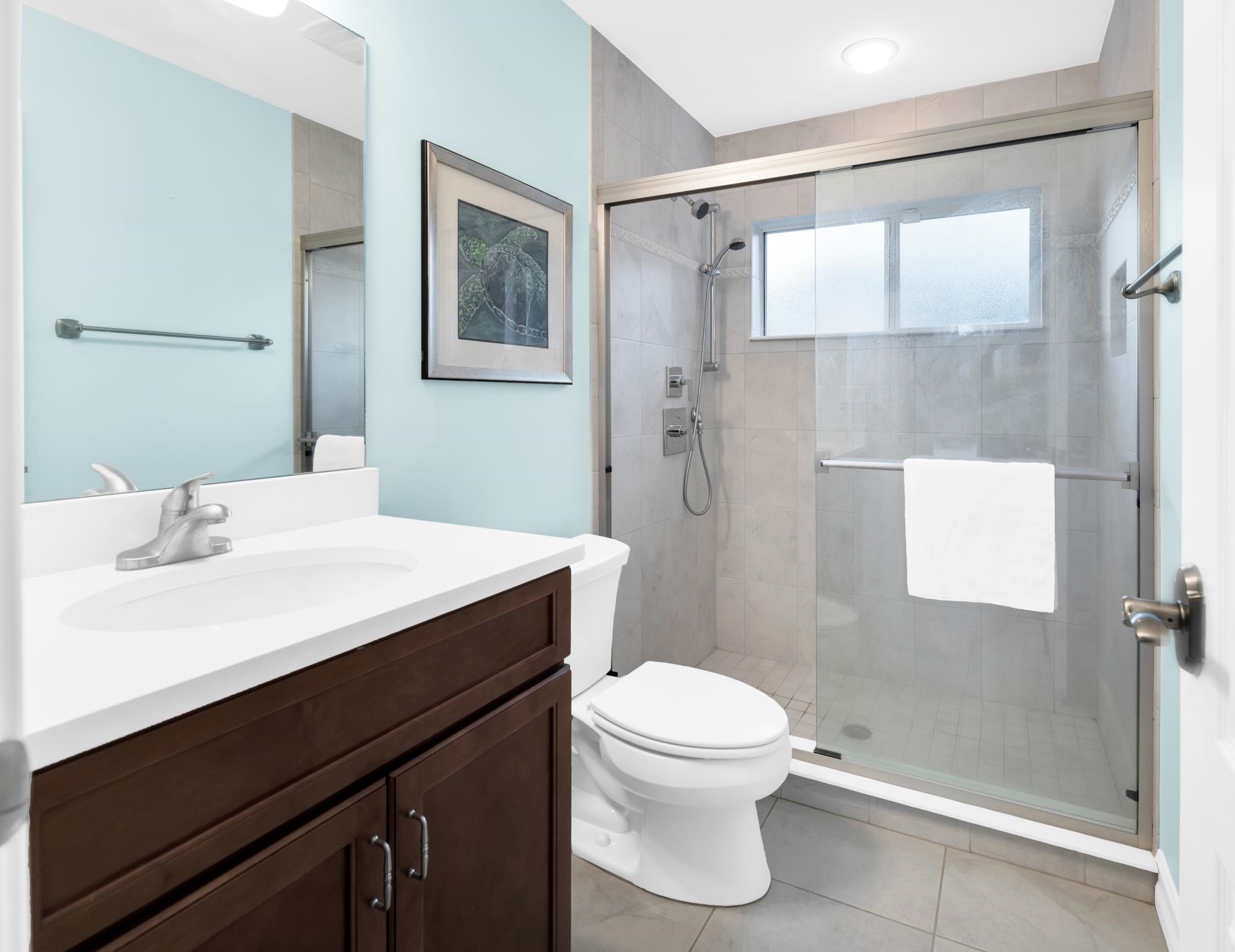 113 Needle Palm Drive St. Augustine, FL 32086 - Photo 40 of 46 a bathroom with a sink a toilet and shower