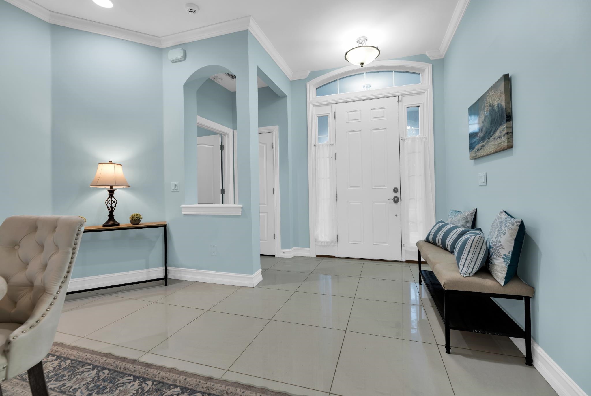 113 Needle Palm Drive St. Augustine, FL 32086 - Photo 4 of 46 a bedroom with furniture and a lamp