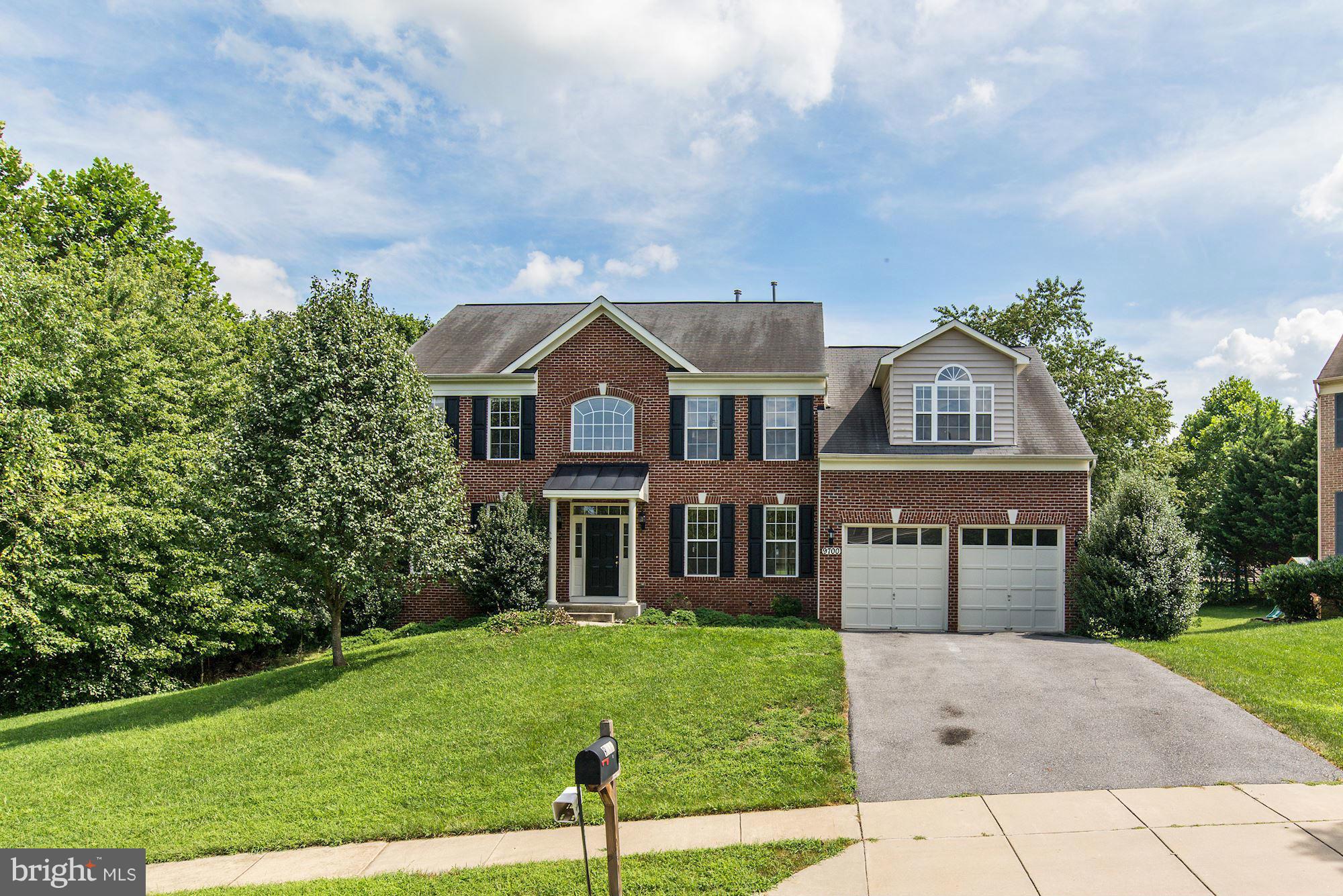 9700 Hickory Spring Lane Gaithersburg, MD 20882 - Photo 1 of 21 a front view of a house with a yard