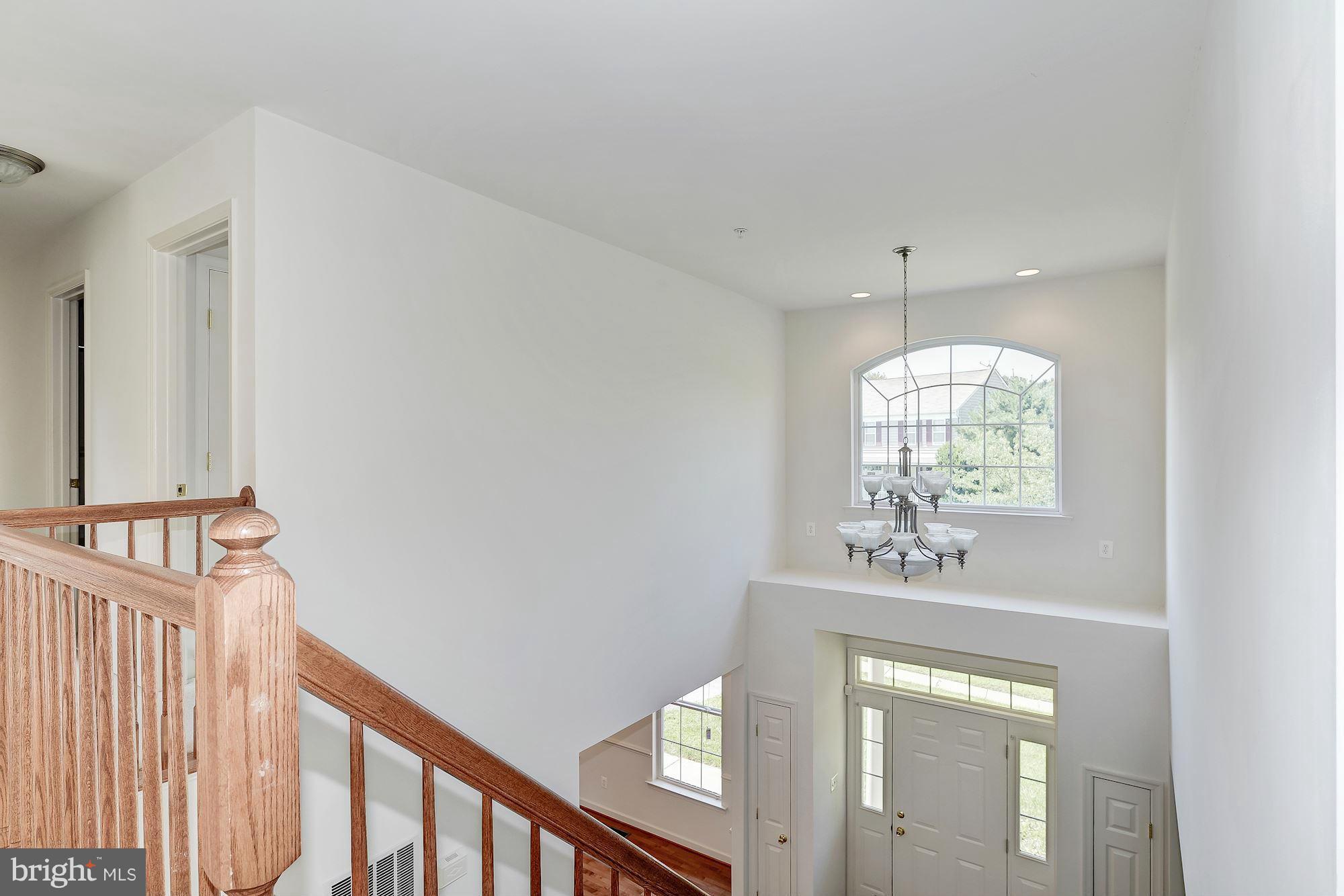 9700 Hickory Spring Lane Gaithersburg, MD 20882 - Photo 17 of 21 a view of a hallway with windows
