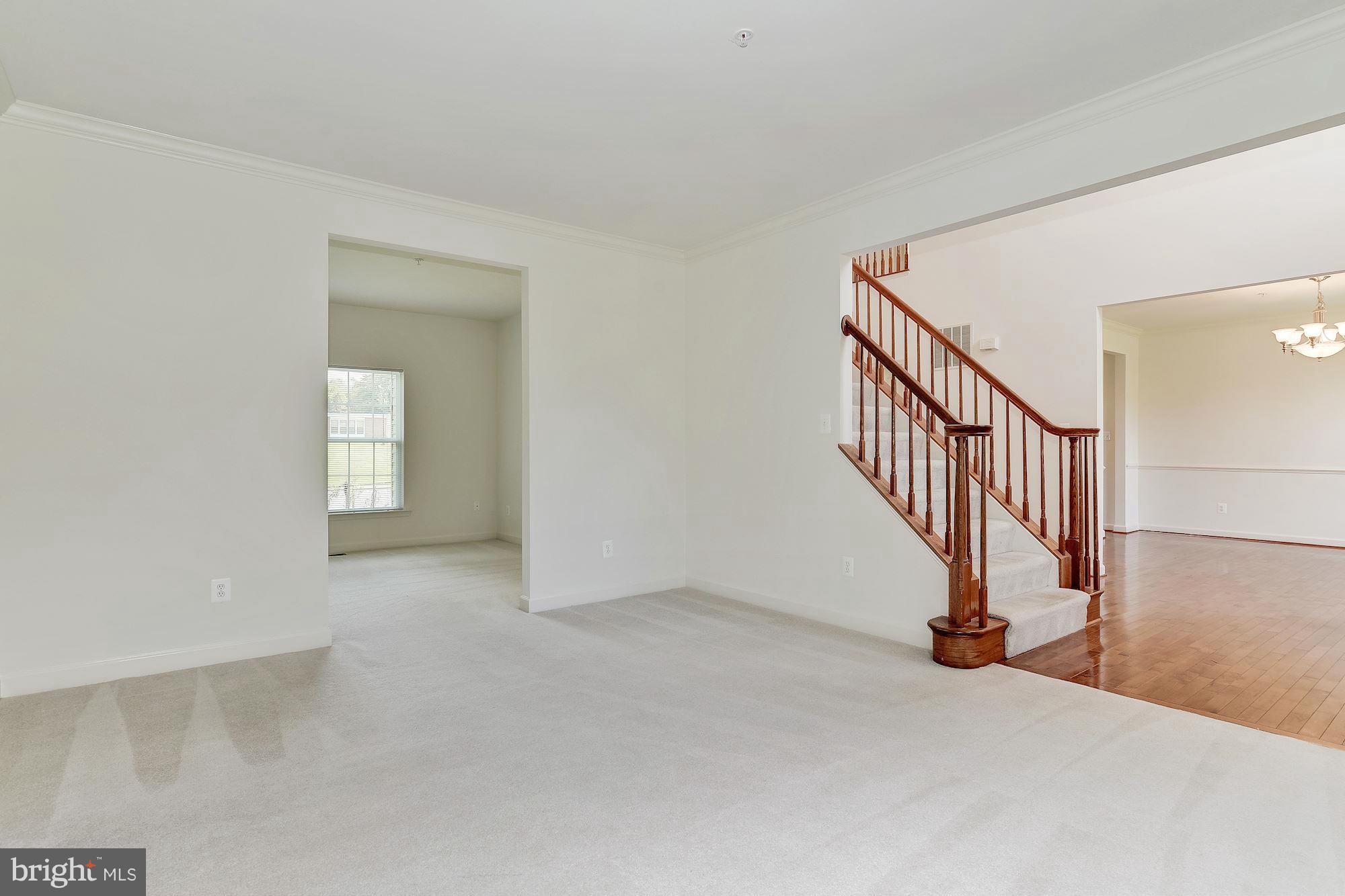9700 Hickory Spring Lane Gaithersburg, MD 20882 - Photo 3 of 21 a view of an entryway with staircase