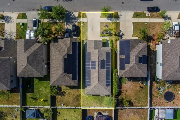 an aerial view of residential houses with outdoor space