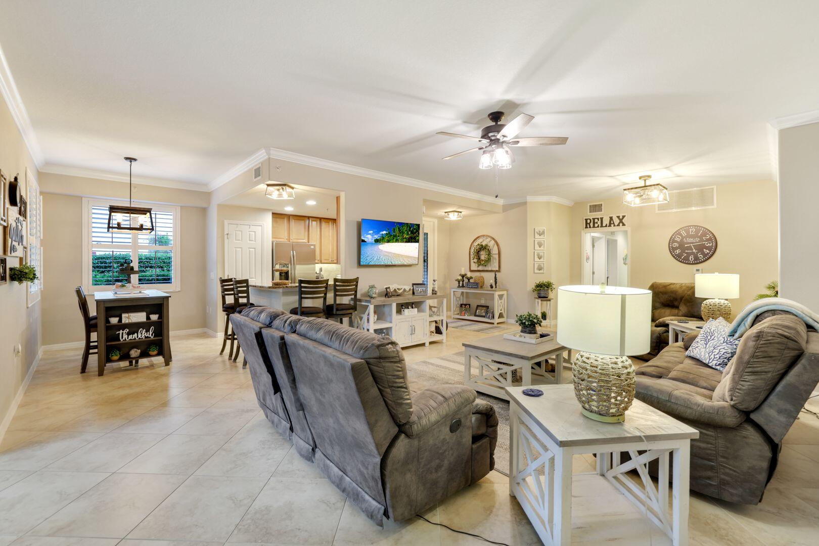 7878 Clemson Street, Unit 102 Naples, FL 34104 - Photo 9 of 20 a view of a dining room with furniture
