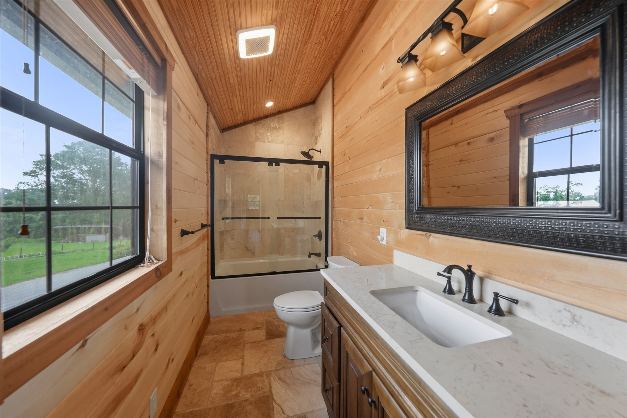 26534 Mitchell Road Hempstead, TX 77445 - Photo 32 of 45 a bathroom with a sink a toilet and a large mirror