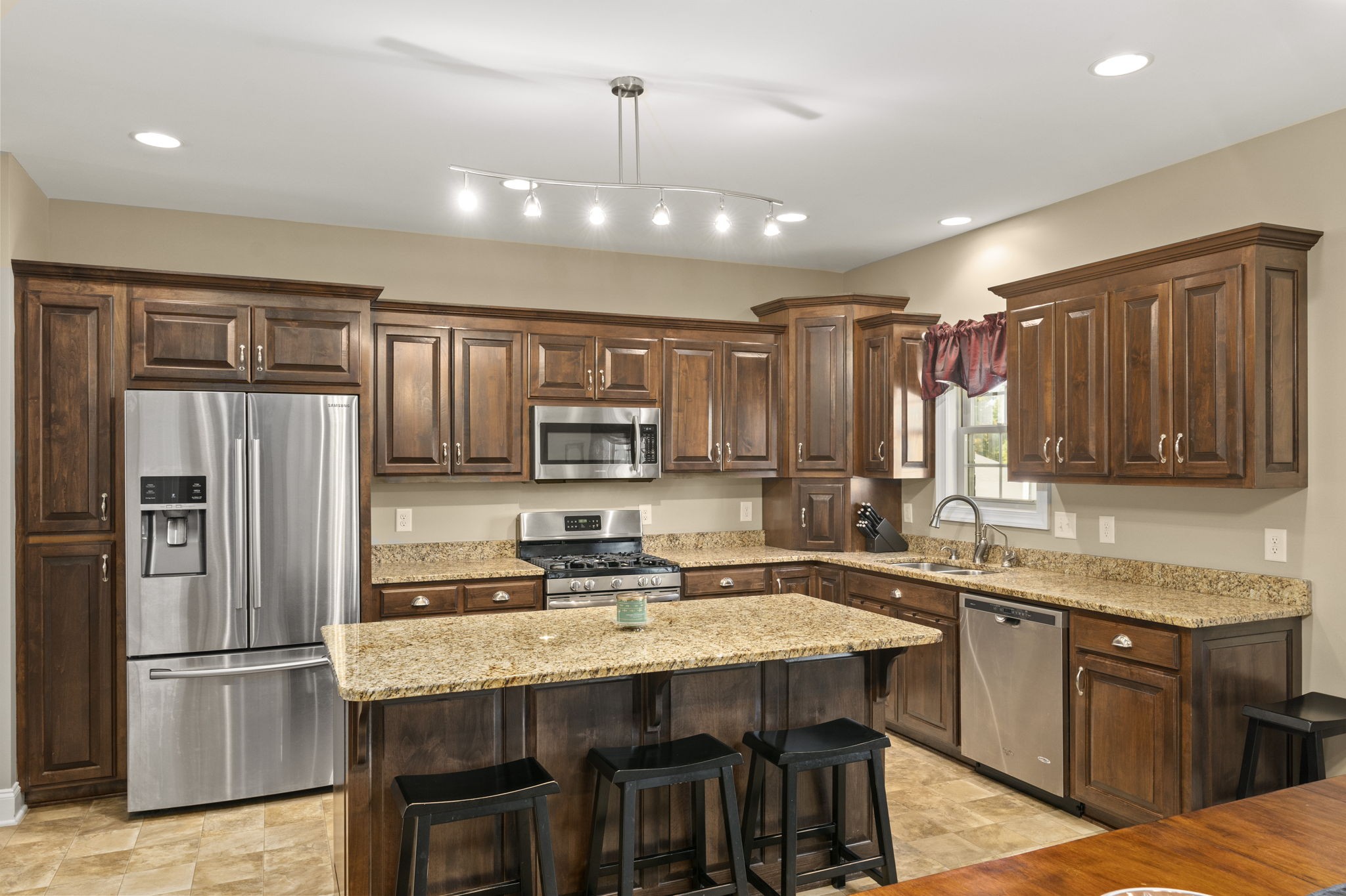 4600 Benson Road Springfield, TN 37172 - Photo 24 of 64 a kitchen with kitchen island granite countertop a sink stainless steel appliances and cabinets