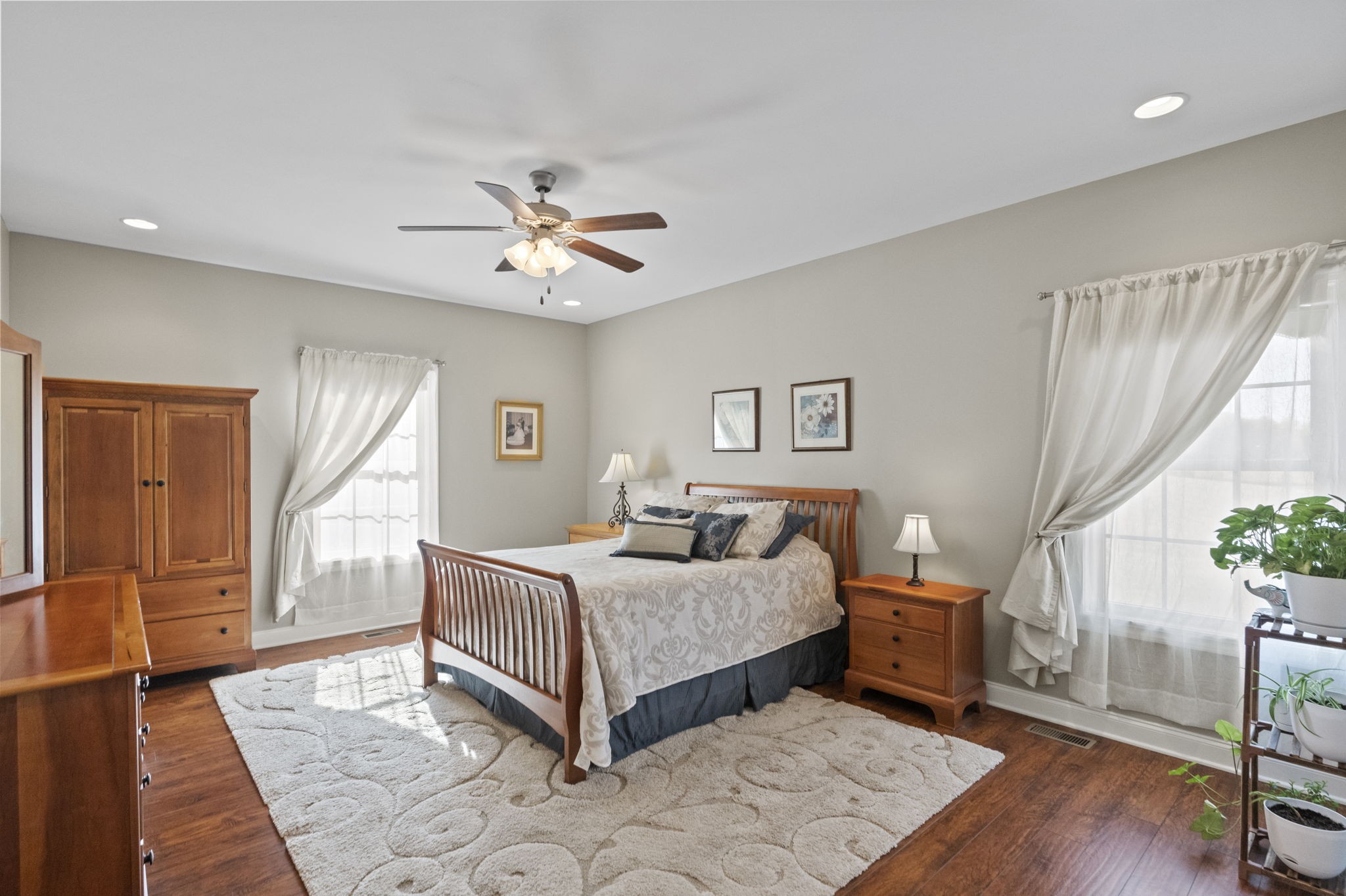 4600 Benson Road Springfield, TN 37172 - Photo 34 of 64 a bedroom with a bed and a chandelier
