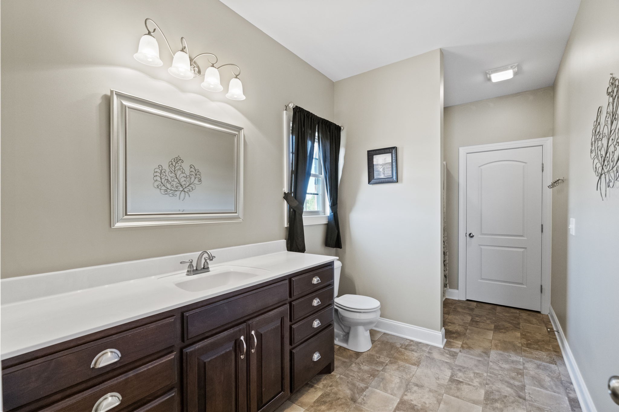 4600 Benson Road Springfield, TN 37172 - Photo 36 of 64 a bathroom with a double vanity sink mirror and toilet