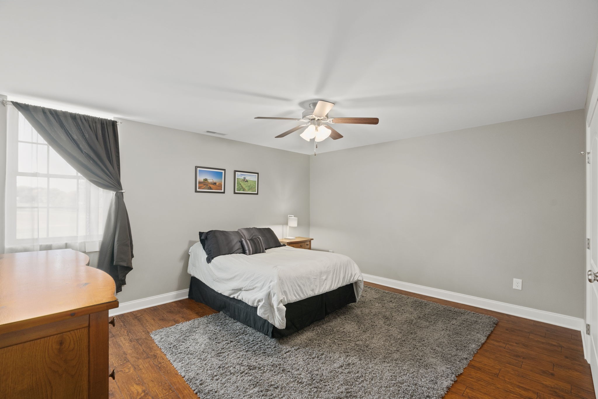 4600 Benson Road Springfield, TN 37172 - Photo 41 of 64 a bedroom with a bed and a chandelier