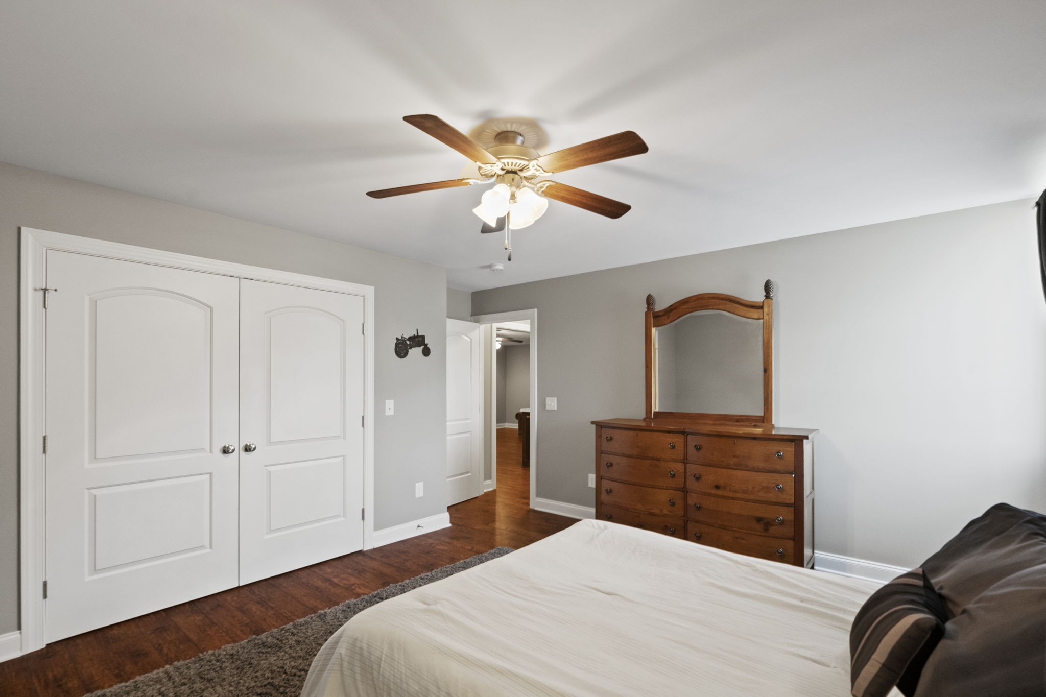 4600 Benson Road Springfield, TN 37172 - Photo 42 of 64 a bedroom with a bed and a chandelier