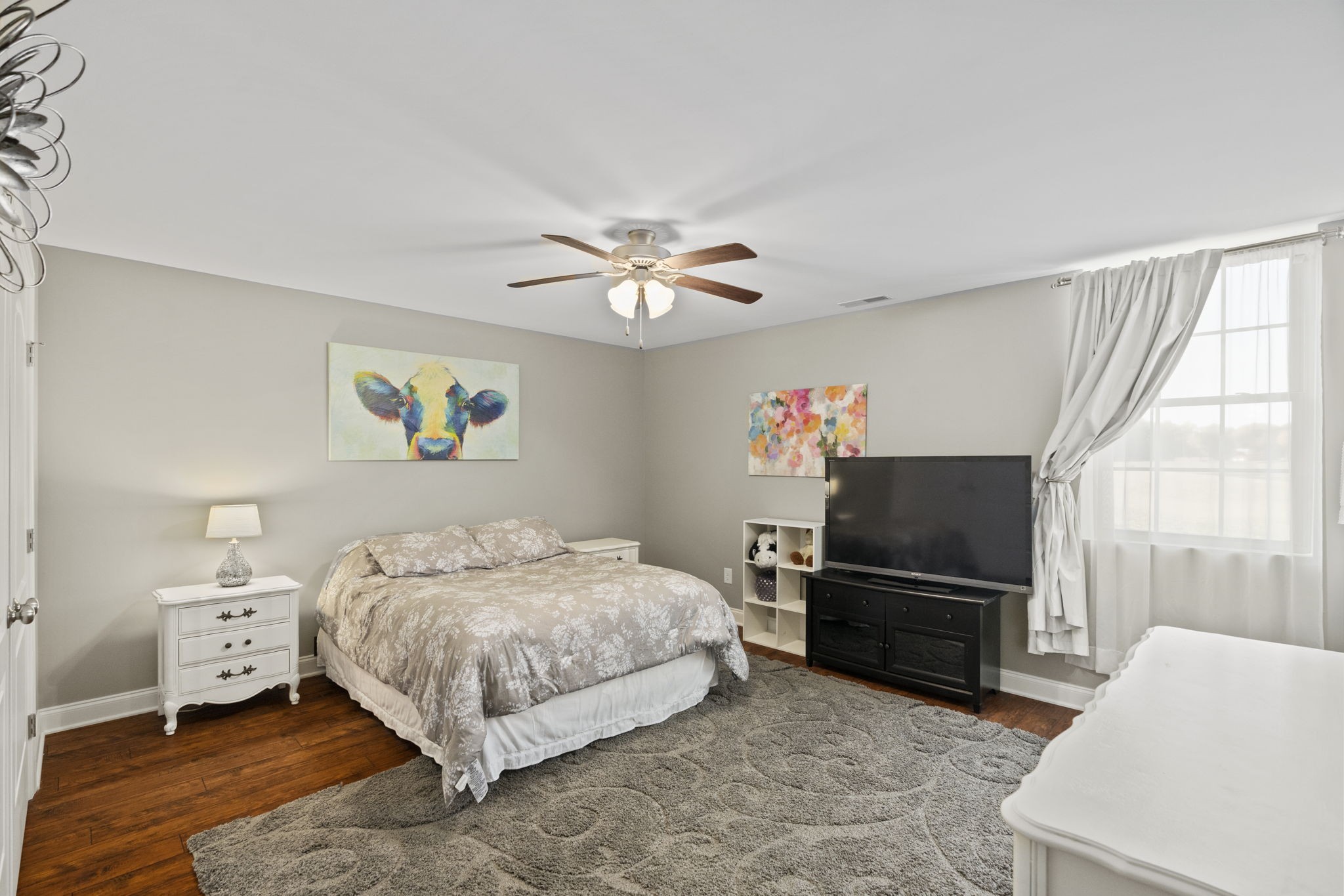 4600 Benson Road Springfield, TN 37172 - Photo 44 of 64 a bedroom with a bed and a chandelier