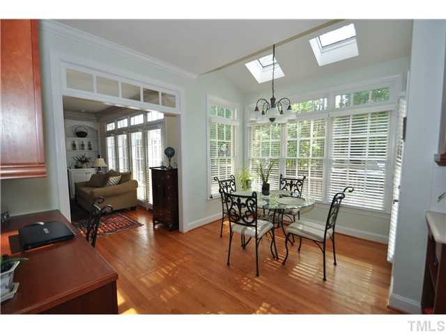 1805 Liatris Lane Raleigh, NC 27613 - Photo 11 of 25 Light and bright breakfast nook with access to the wonderful back deck. Enjoy all the natural lighting with the whole wall of windows and sky lights!