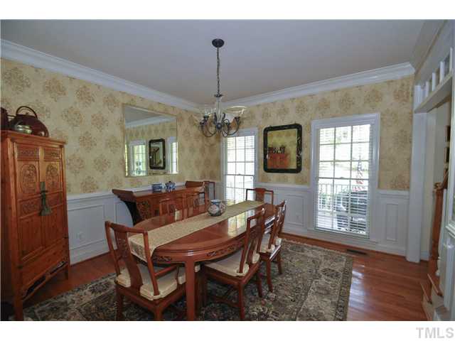 1805 Liatris Lane Raleigh, NC 27613 - Photo 4 of 25 Elegant formal dining room with gorgeous wainscoting and crown molding. Perfect spot to enjoy a special meal with family and friends