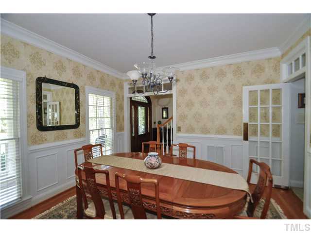 1805 Liatris Lane Raleigh, NC 27613 - Photo 5 of 25 Elegant formal dining room with gorgeous wainscoting and crown molding. Perfect spot to enjoy a special meal with family and friends