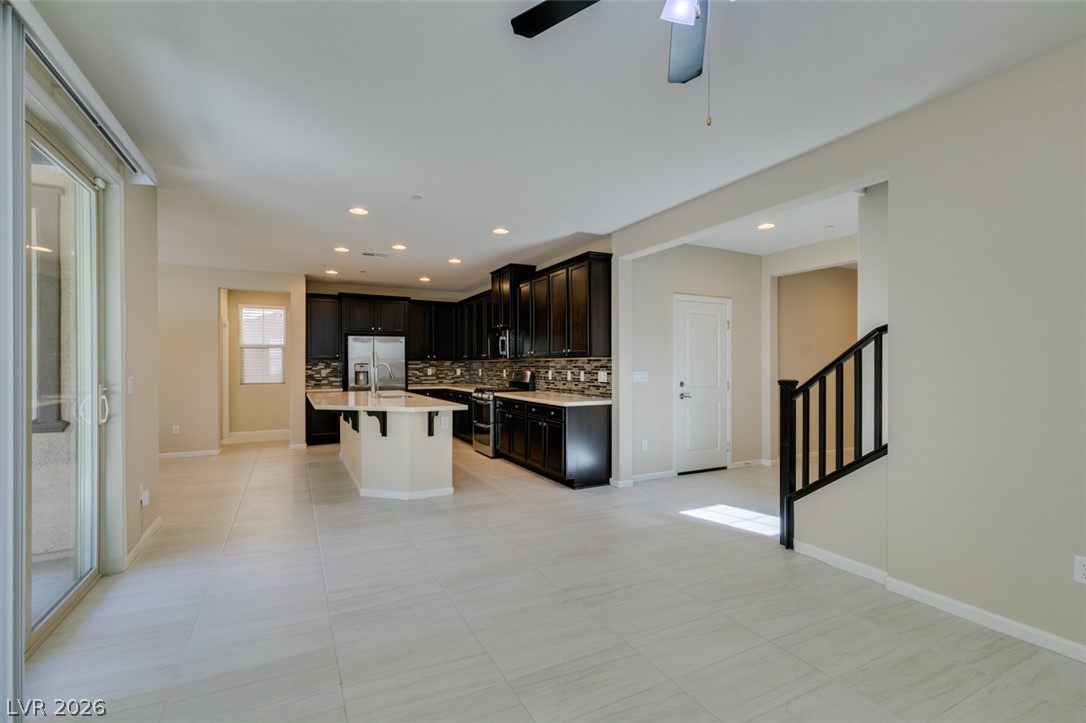 2549 Sable Ridge Street Henderson, NV 89044 - Photo 15 of 48 An open-concept living space with a modern kitchen and ample natural light.