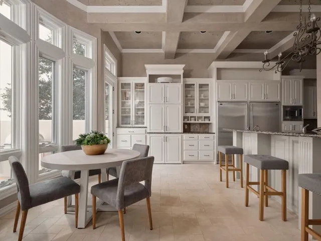 a kitchen with stainless steel appliances granite countertop a stove and cabinets