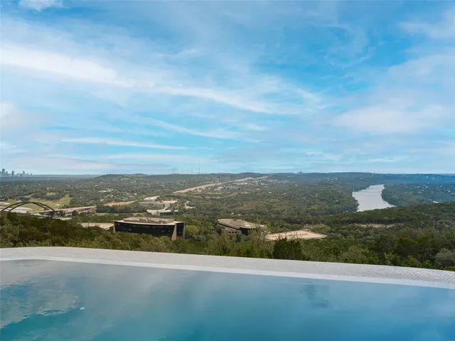 a view of a terrace with furniture and a yard