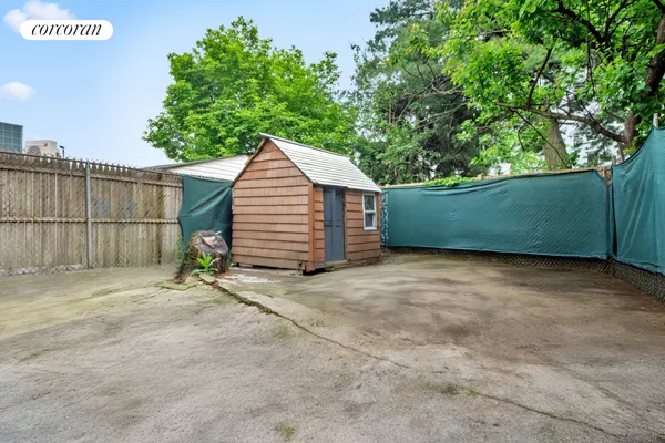 a view of backyard and tree