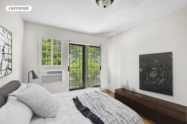 a bedroom with a bed and a couch
