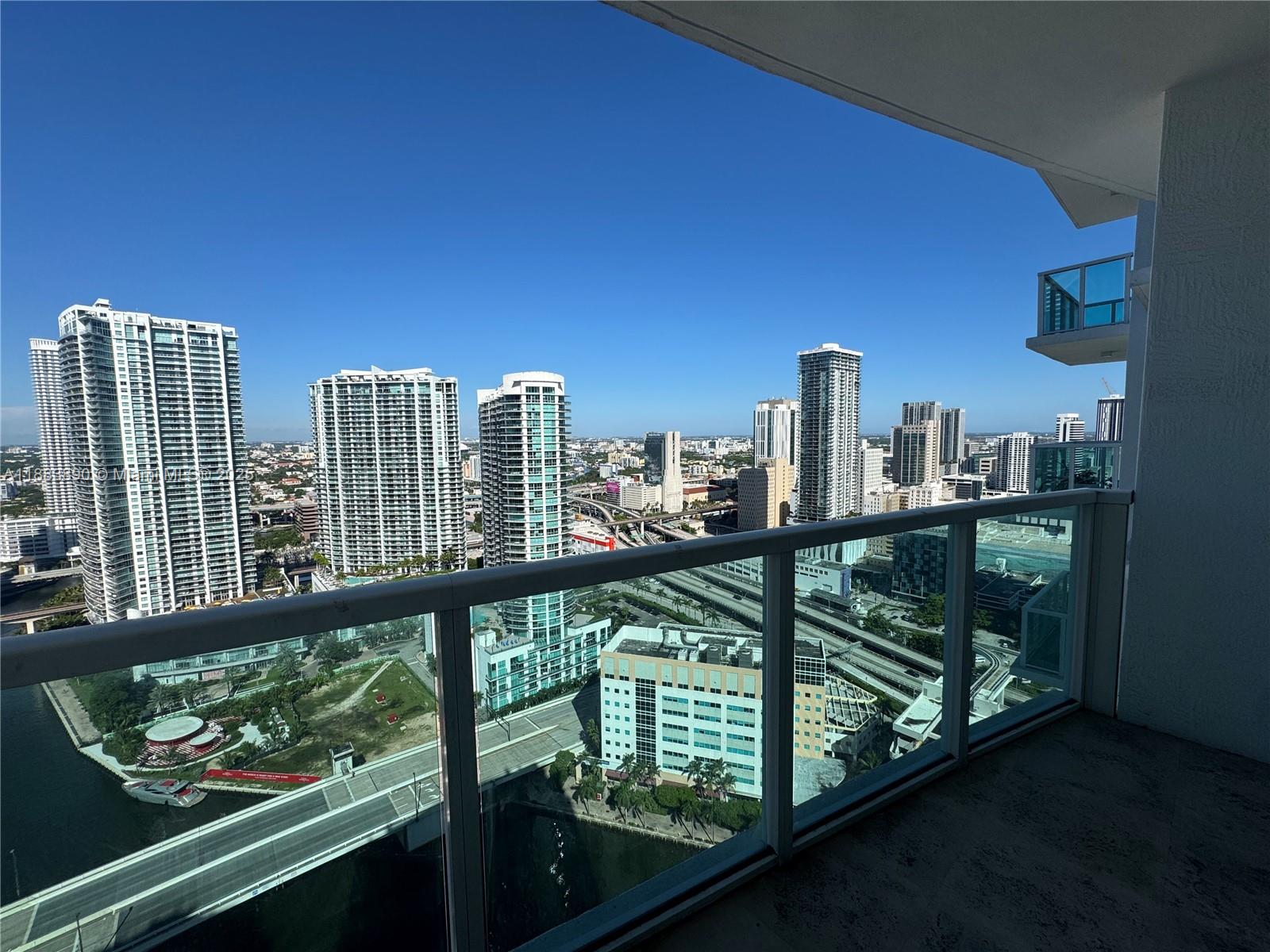 31 Southeast 5th Street, Unit 3817 Miami, FL 33131 - Photo 16 of 26 a view of a city skyline from a balcony