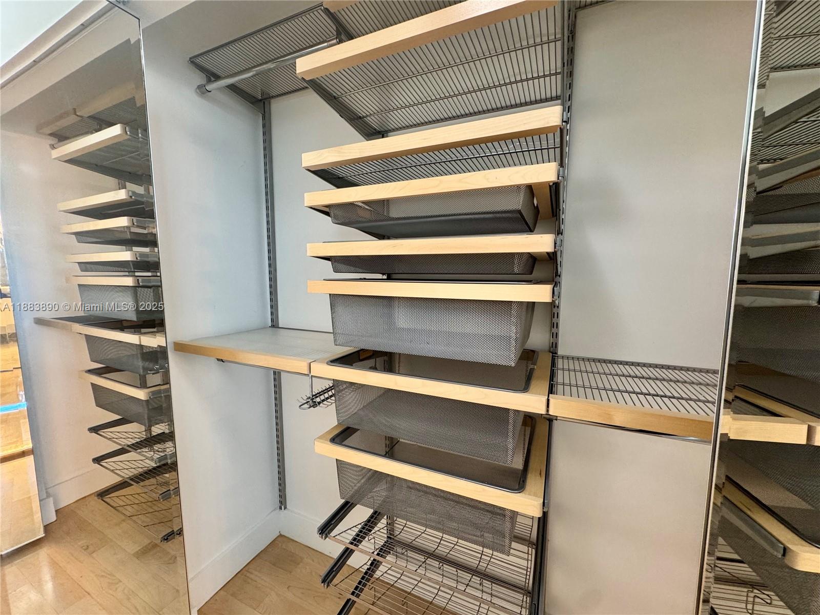 31 Southeast 5th Street, Unit 3817 Miami, FL 33131 - Photo 24 of 26 a view of an empty room with wooden floor and windows