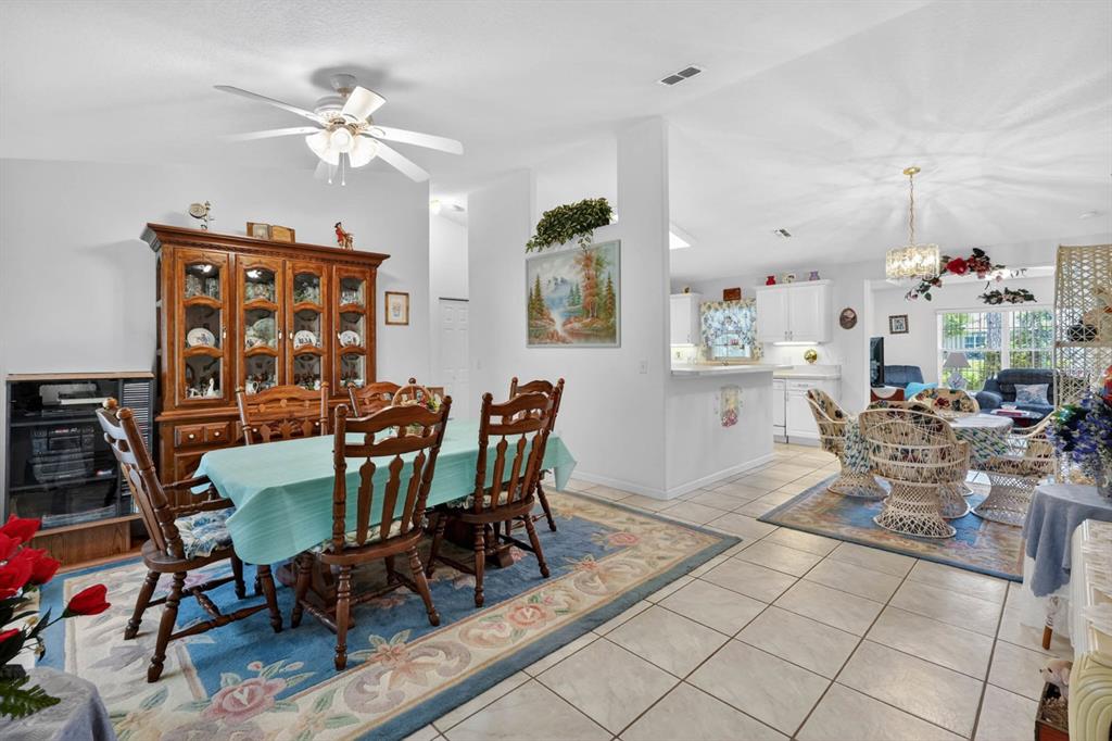 80 Roxboro Drive Palm Coast, FL 32164 - Photo 7 of 39 a view of a dining room with furniture