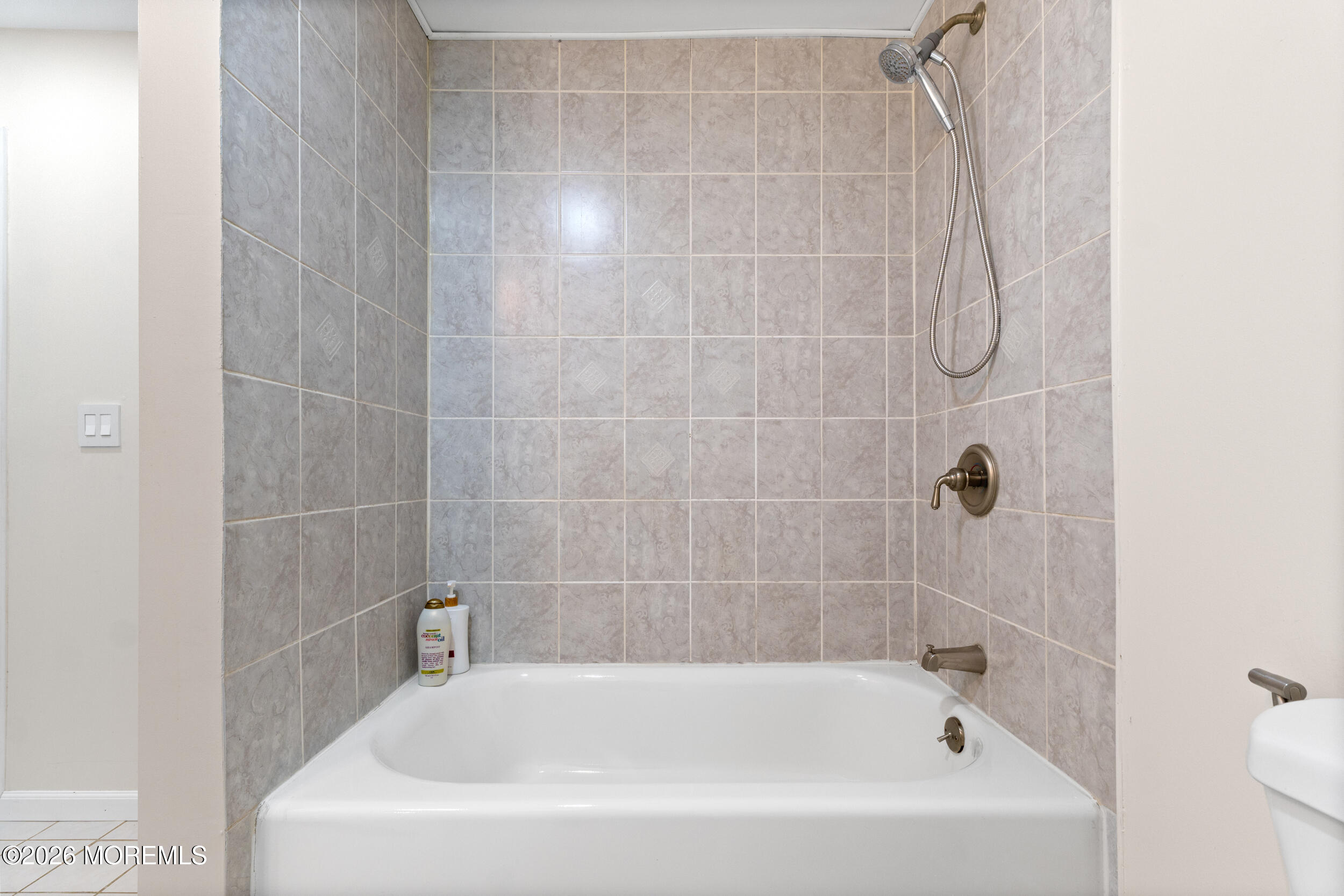104 Autumn Road Matawan, NJ 07747 - Photo 49 of 64 a white bath tub sitting next to a white sink and vanity