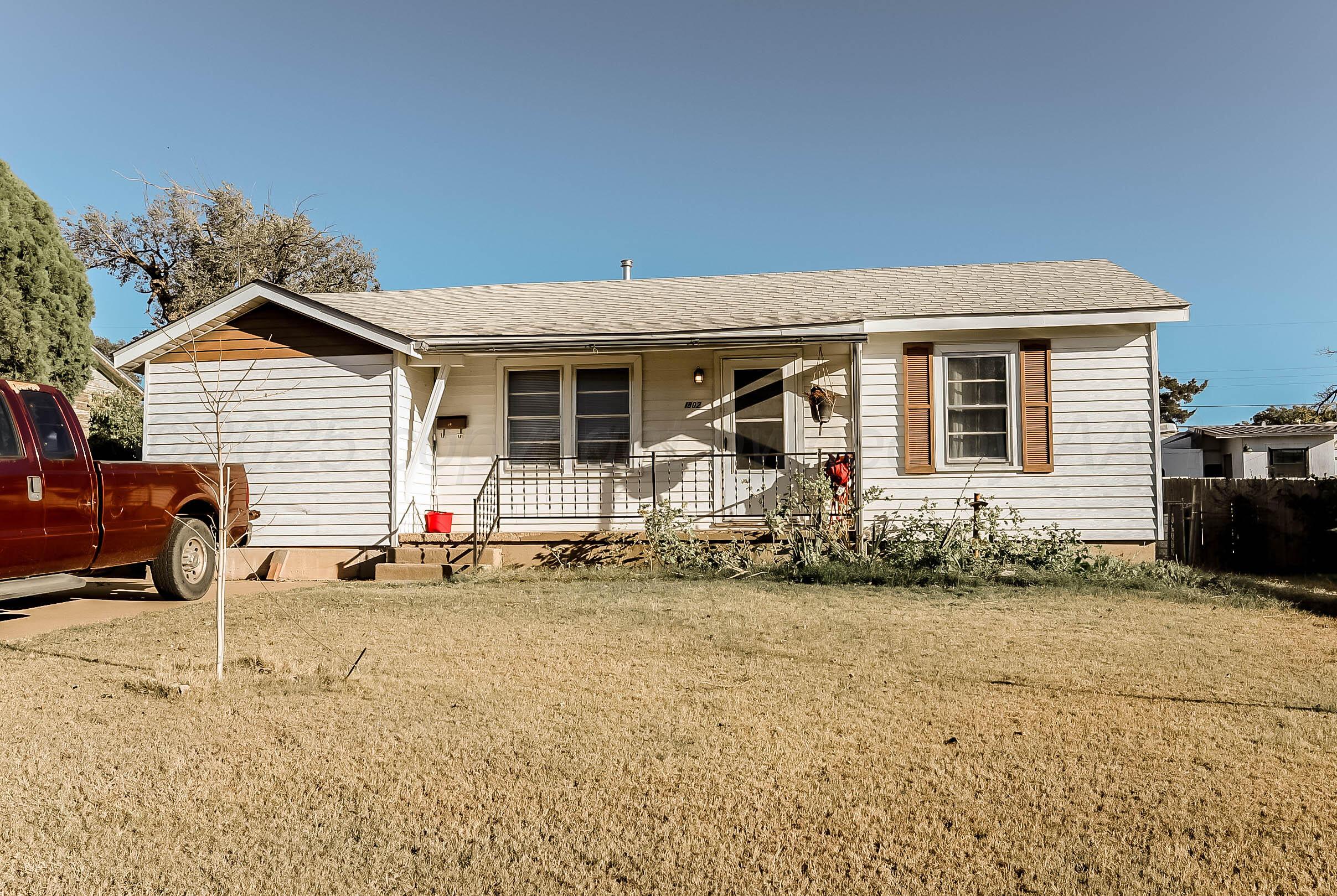 front view of a house with a patio