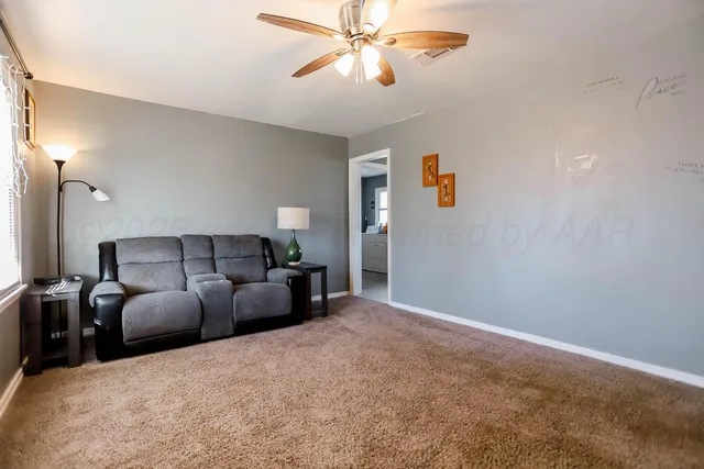 a bed room with bed and window