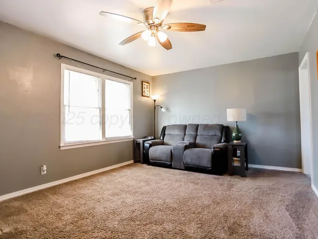 a bed room with furniture and a window