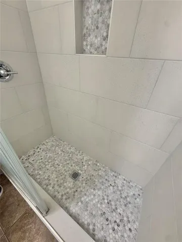 a view of an empty room with a window