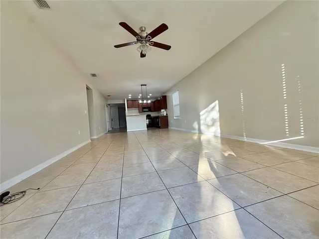 a view of an empty room and a window