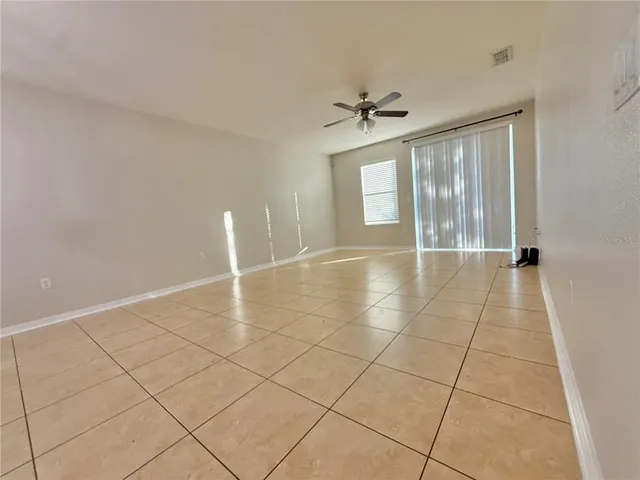 a view of an empty room and window
