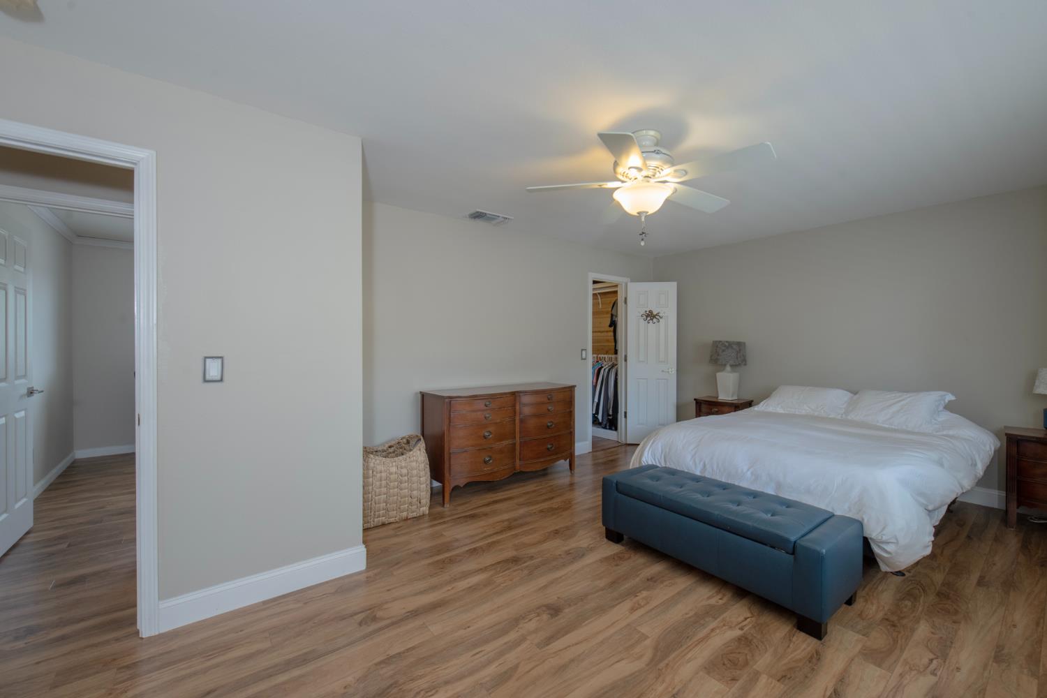 29395 Revis Road Coarsegold, CA 93614 - Photo 5 of 32 a bedroom with a bed and a chandelier
