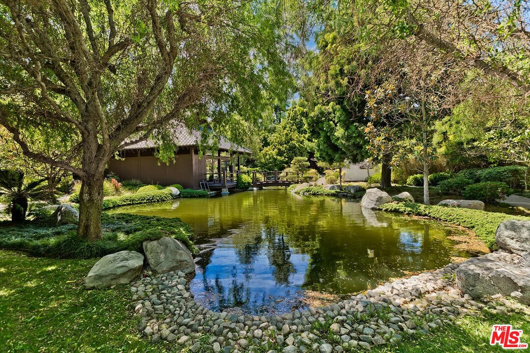 205 Ladera Drive Los Angeles, CA 90210 - Photo 5 of 10 a view of a lake with a house in the background