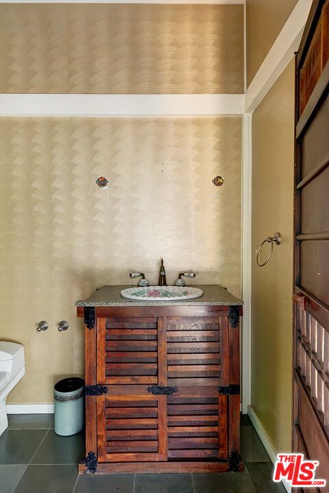205 Ladera Drive Los Angeles, CA 90210 - Photo 8 of 10 a view of bathroom with a sink and a toilet