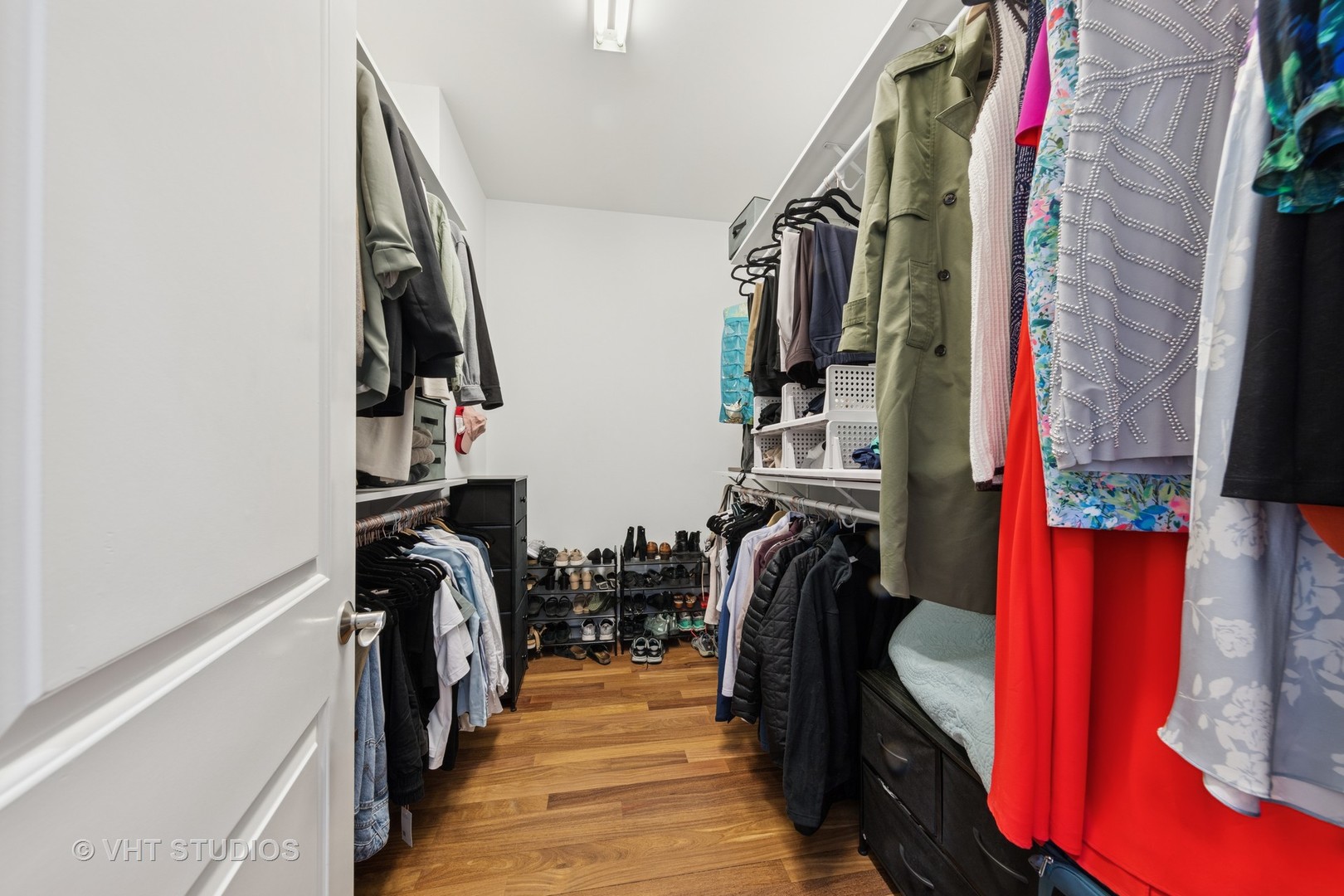 955 West Monroe Street, Unit 2C Chicago, IL 60607 - Photo 13 of 23 a view of walk in closet with clothes and shoes