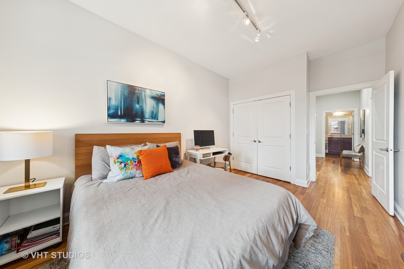 955 West Monroe Street, Unit 2C Chicago, IL 60607 - Photo 14 of 23 a bedroom with a bed and a flat screen tv