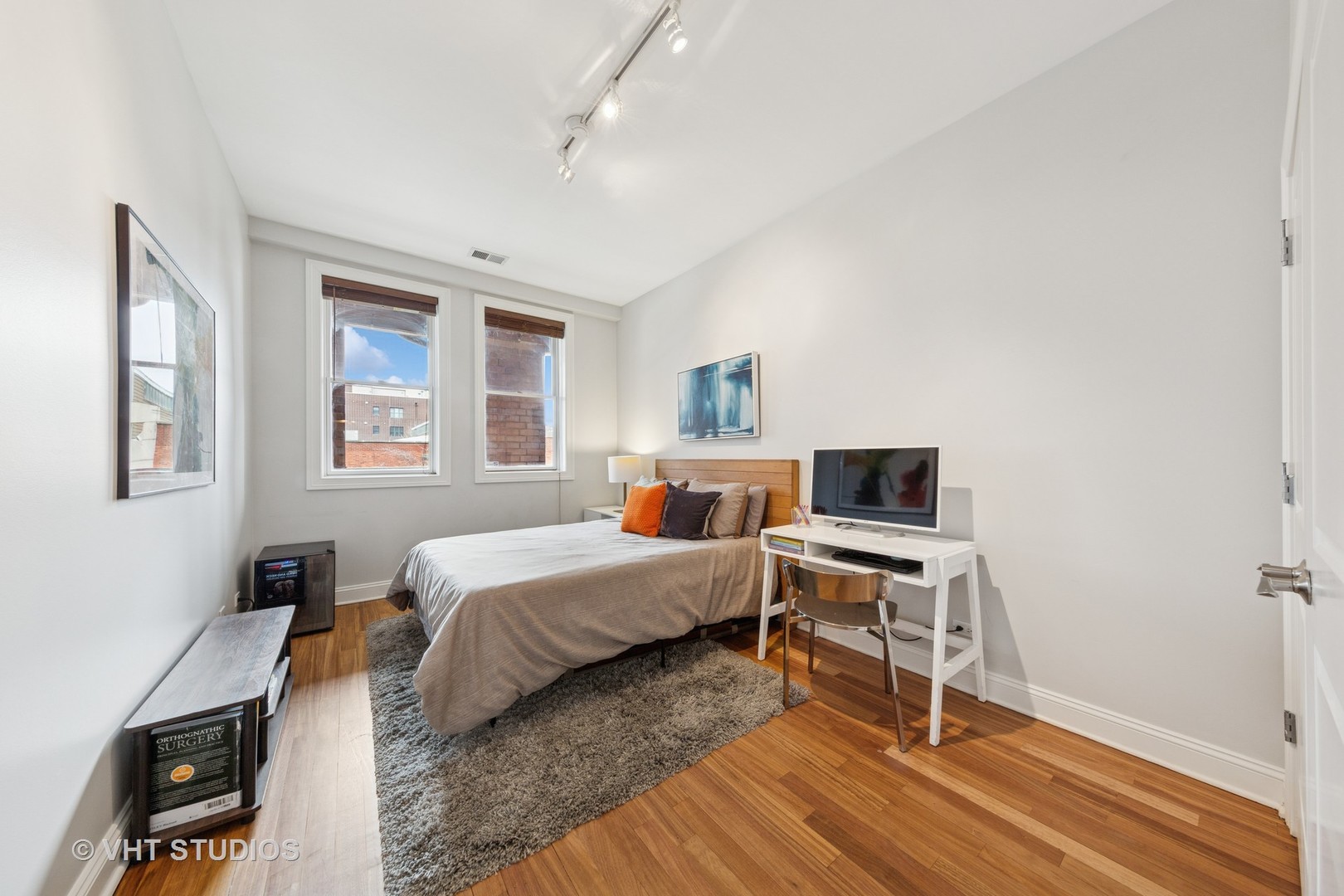 955 West Monroe Street, Unit 2C Chicago, IL 60607 - Photo 15 of 23 a room with a bed and a desk