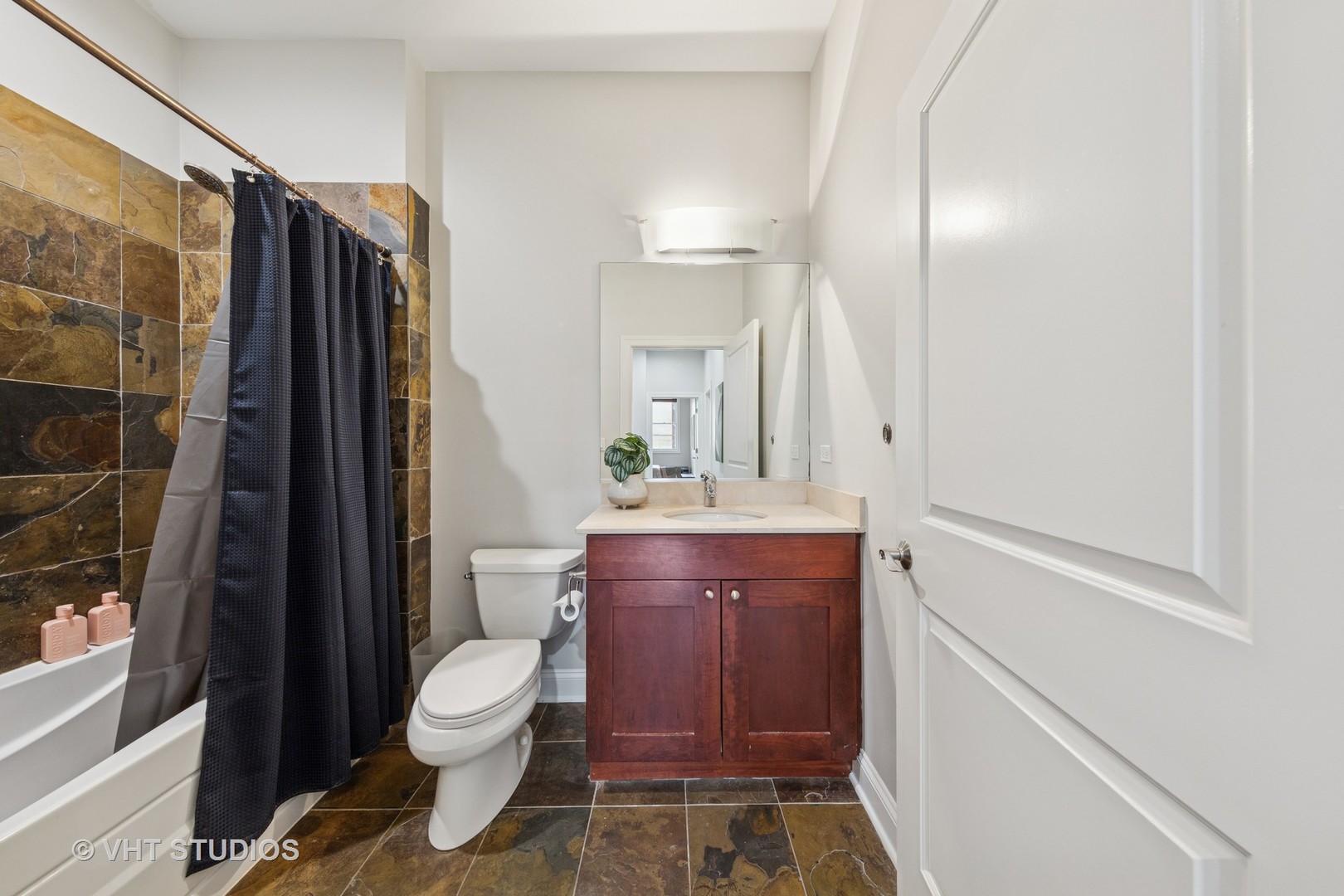 955 West Monroe Street, Unit 2C Chicago, IL 60607 - Photo 16 of 23 a bathroom with a toilet a sink and shower