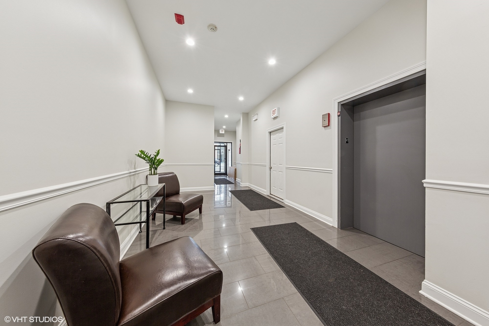 955 West Monroe Street, Unit 2C Chicago, IL 60607 - Photo 22 of 23 a living room with furniture and a chandelier